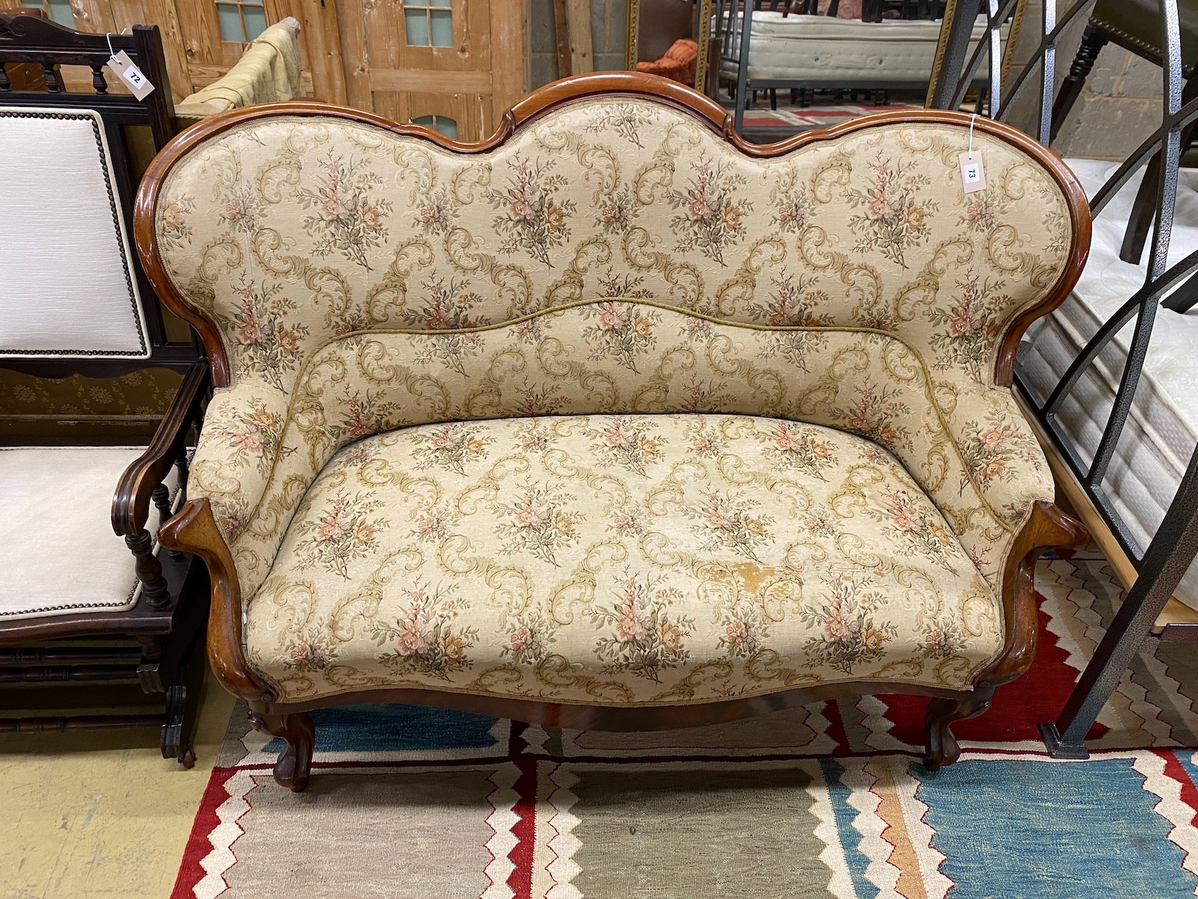 A 19th century French mahogany double spoon back settee, length 152cm, width 62cm, height 96cm